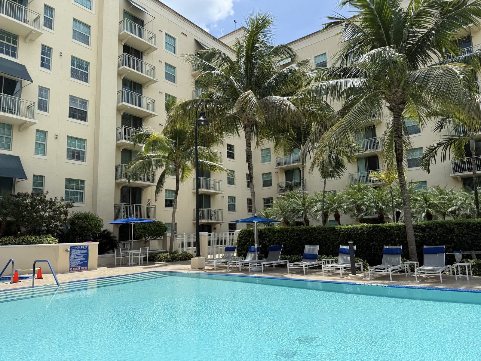 610 Clematis — Resort-style pool deck and spa, framed by the courtyard