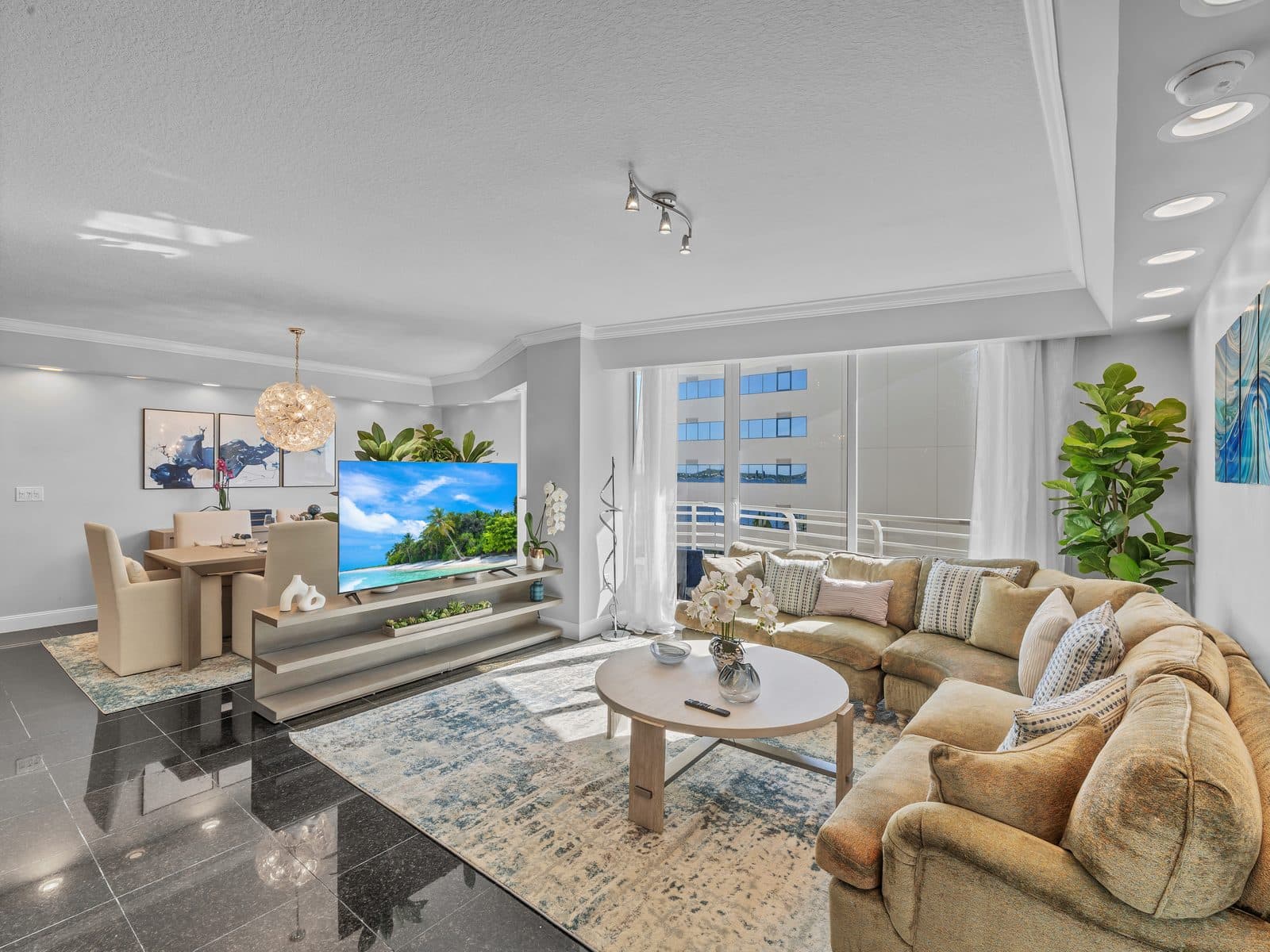 A staged West Palm Beach condo living room photographed for a DO Homes Group listing