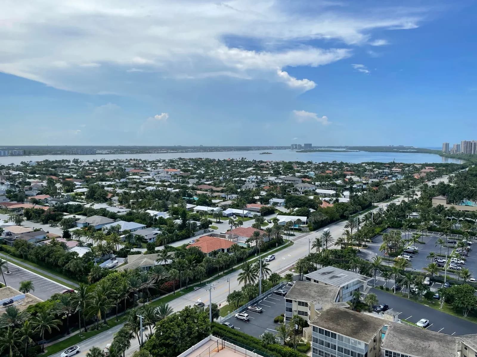High-rise view west over Singer Island streets and houses toward the Lake Worth Lagoon