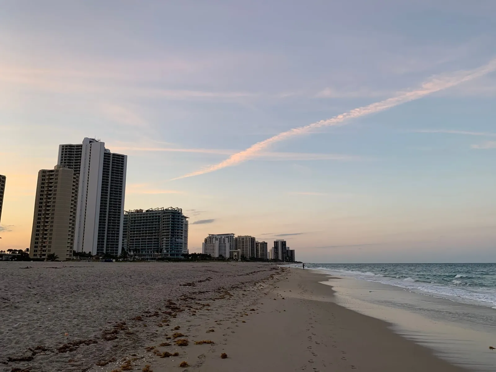 The Singer Island ocean beach at dusk, with the condominium towers along North Ocean Drive