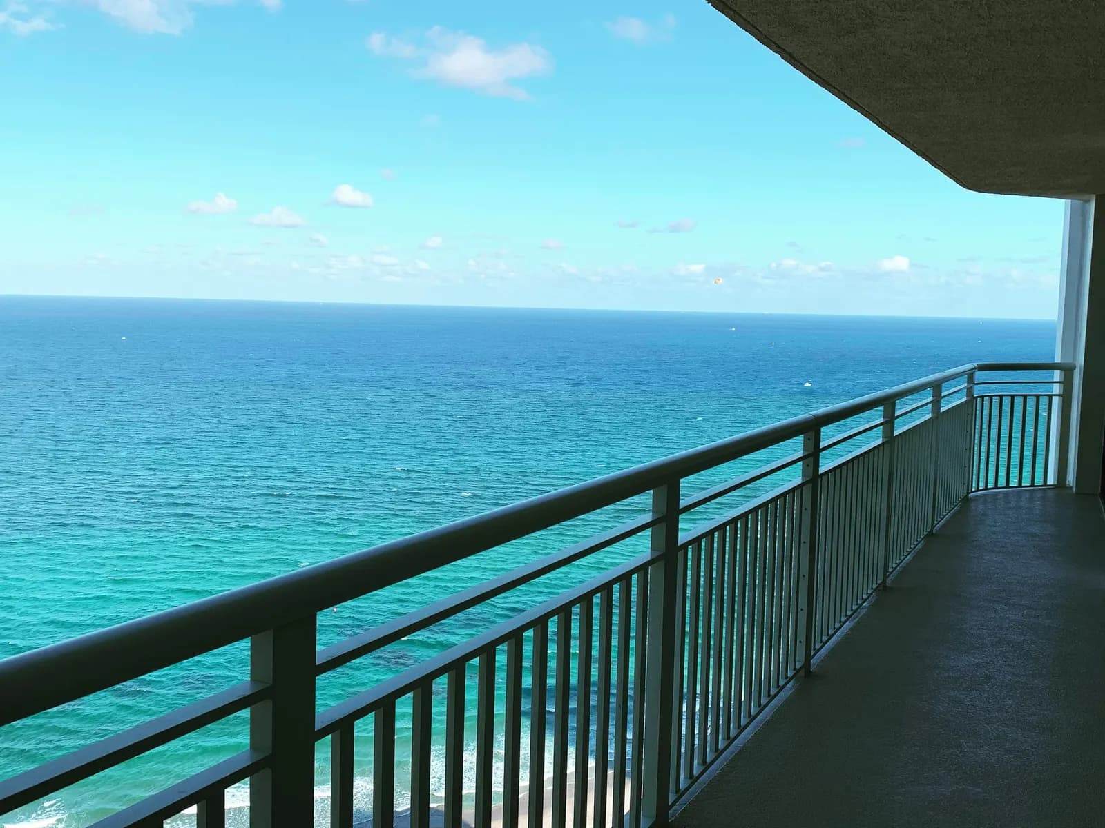The Atlantic from a high-floor Tiara balcony with a curved white railing