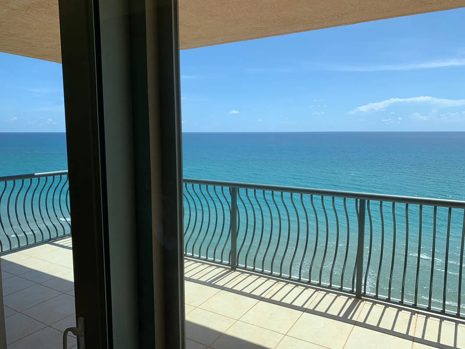 The Atlantic from a high-floor Via Delfino terrace